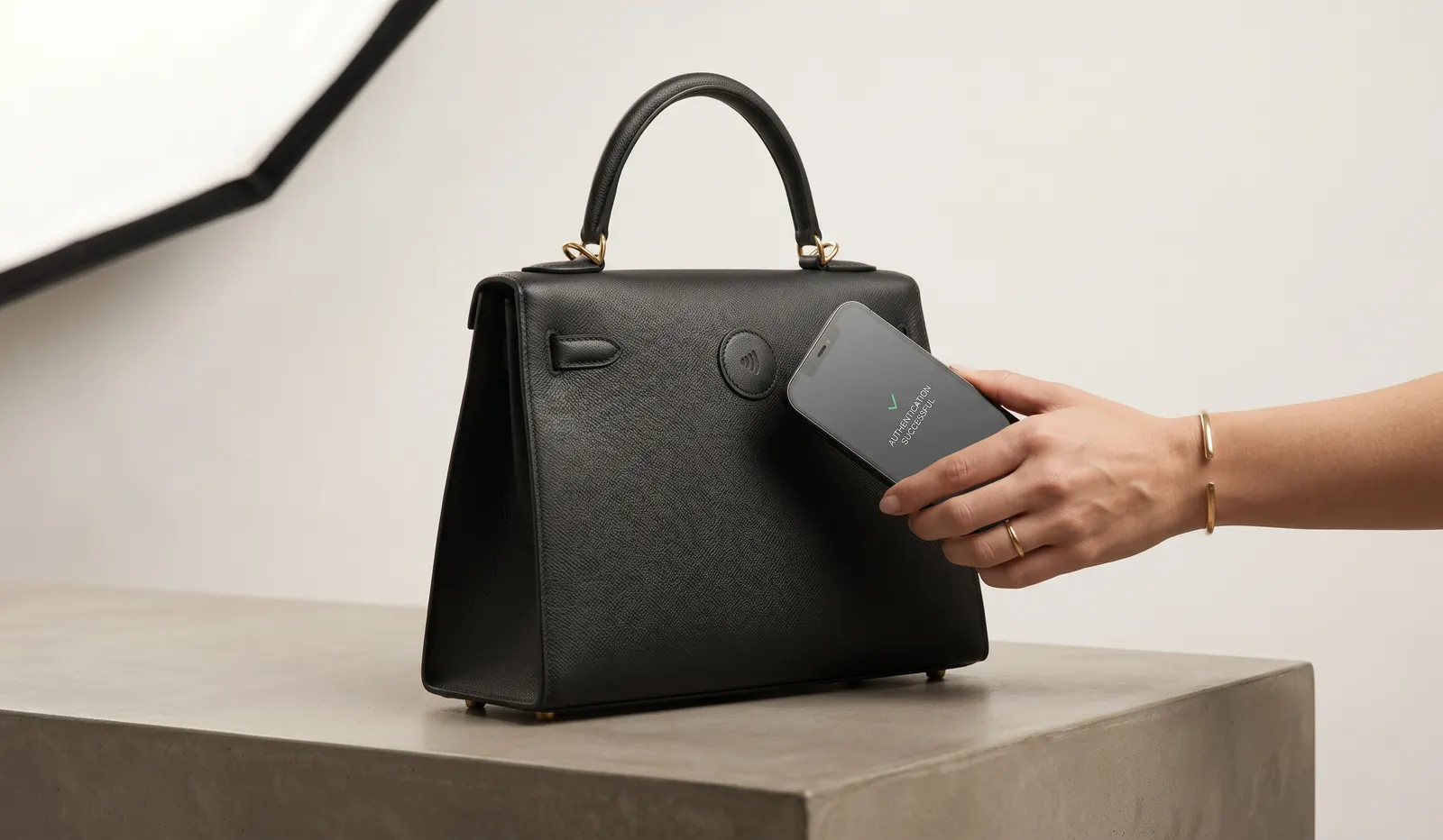 Luxury handbag being verified with TrueTap NFC authentication
